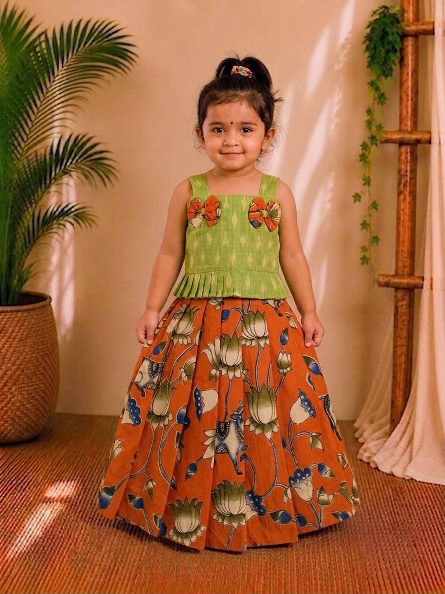 (CTS011)Traditional lotus and Pichwai-inspired orange and green Lehenga set.