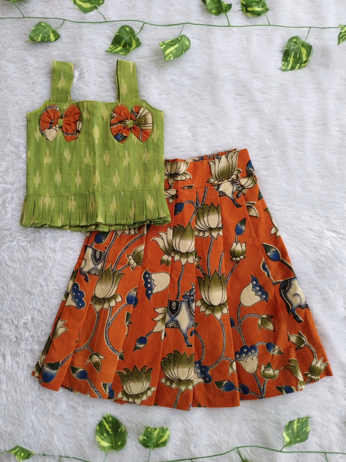 (CTS011)Traditional lotus and Pichwai-inspired orange and green Lehenga set.