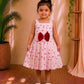 (ETF004) Girls Peachy Pink Floral Frock with Red Bow